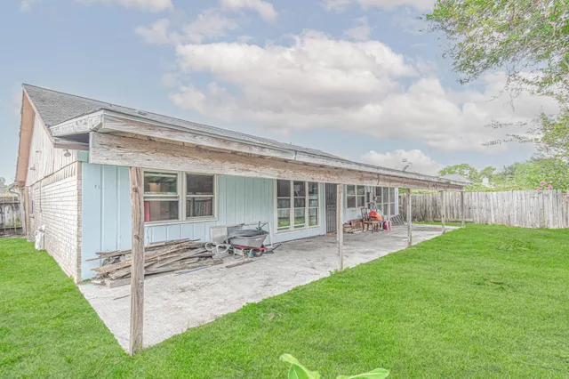 a view of a hallway with chandelier and entryway