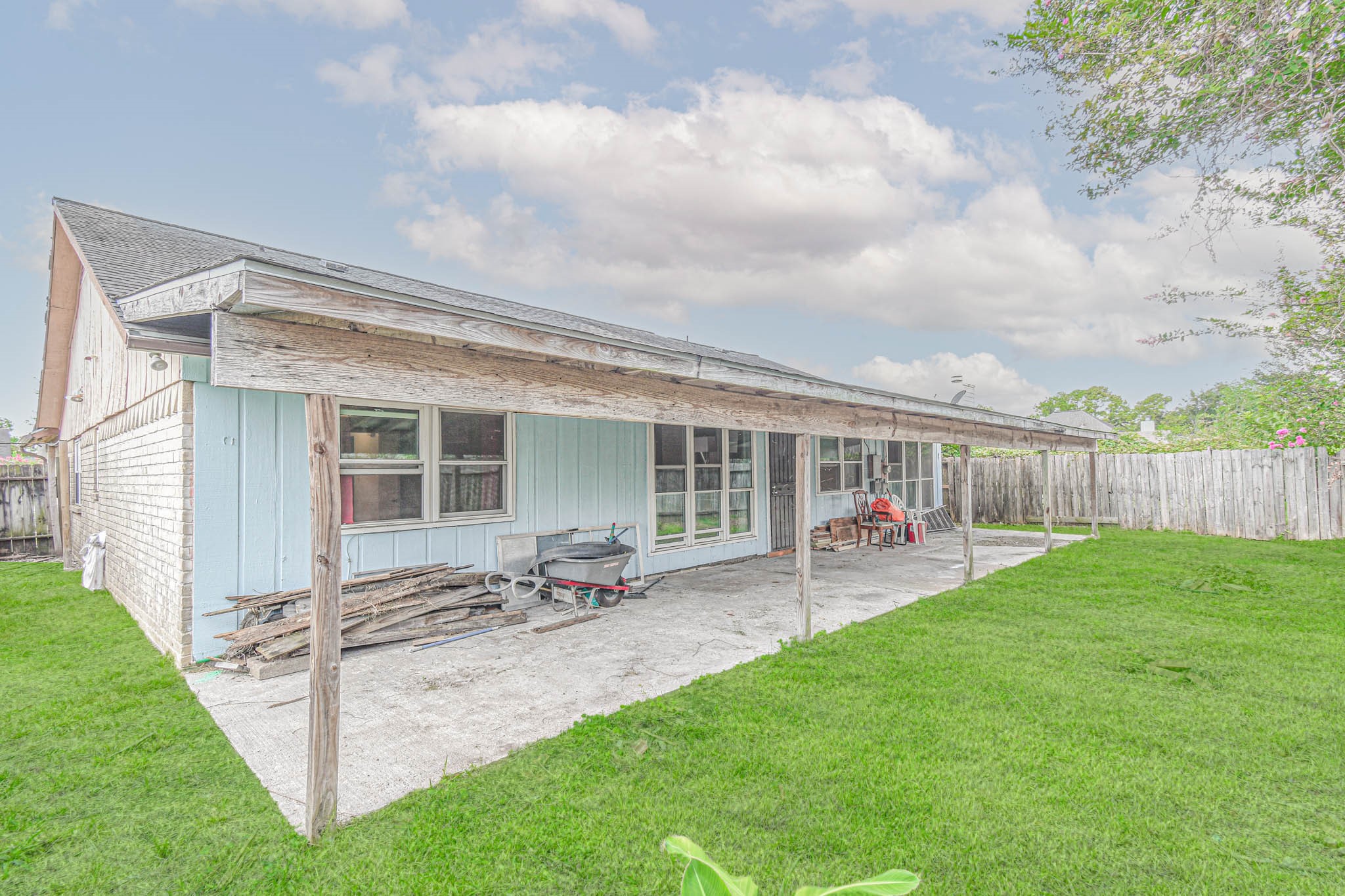 12054 Plumpoint Drive Houston, TX 77099 - Photo 4 of 24 a view of a house with backyard and porch