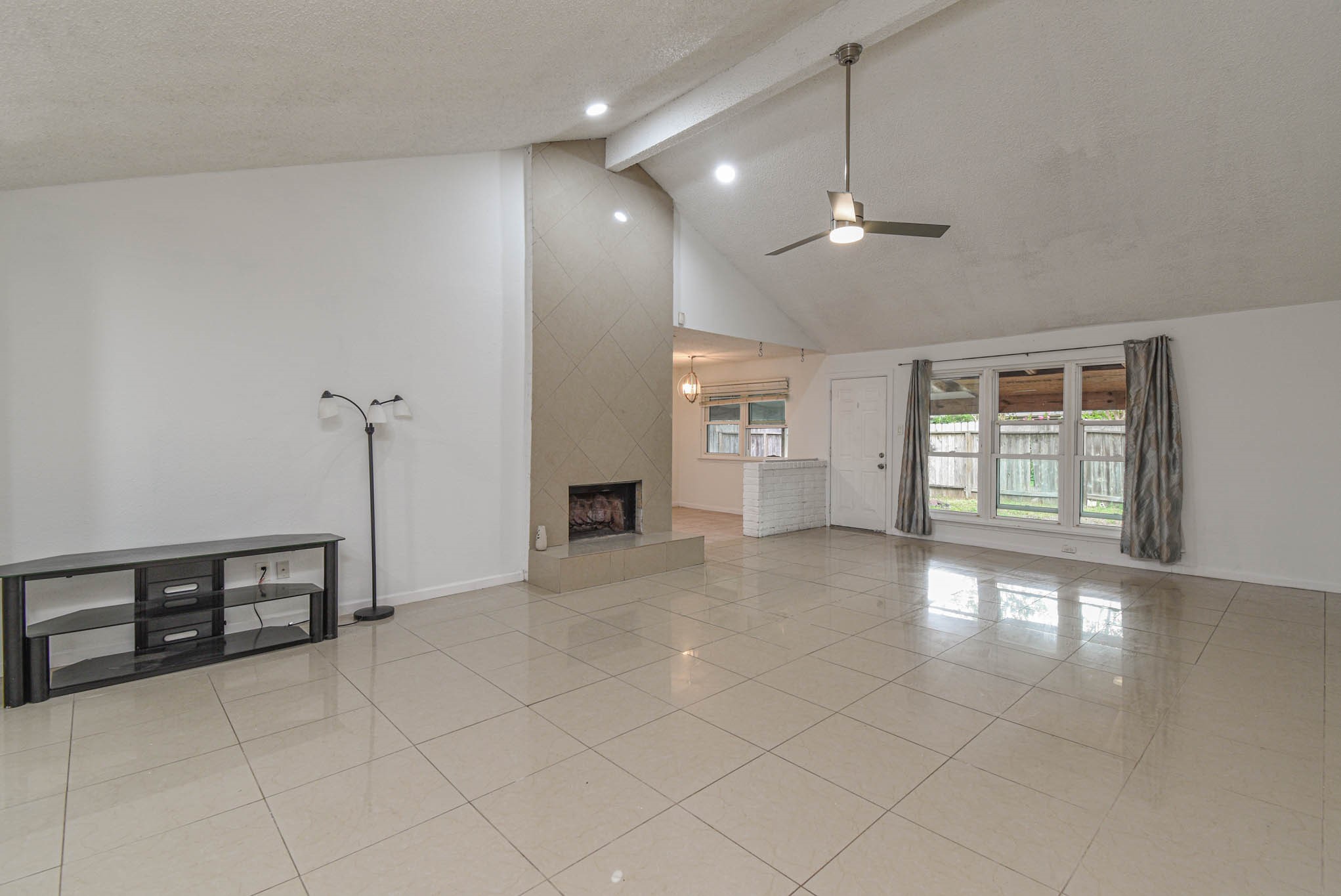 12054 Plumpoint Drive Houston, TX 77099 - Photo 7 of 24 a view of an empty room with glass door