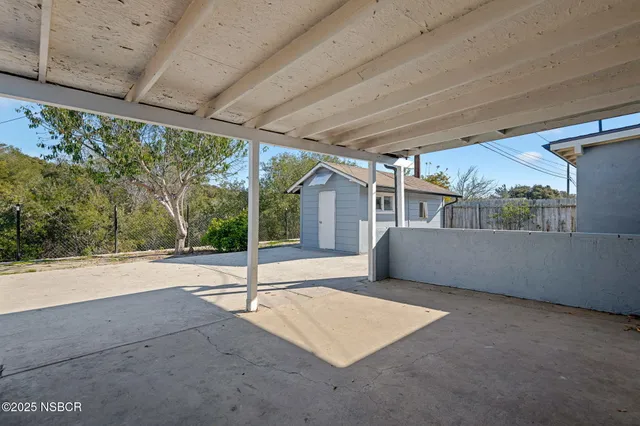 a view of an empty room with a balcony