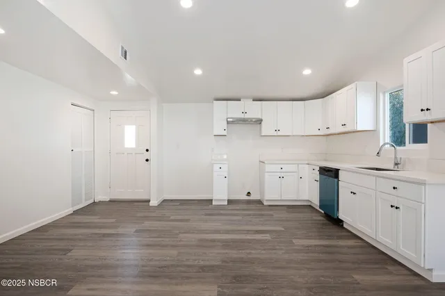 a view of kitchen with wooden floor