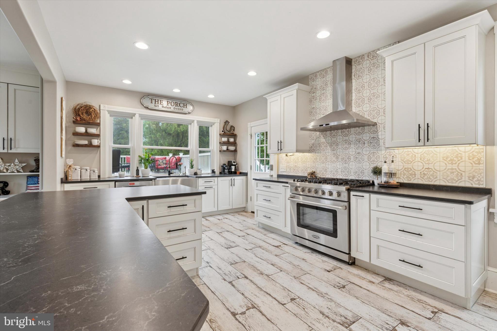 802 Upper Gulph Road Wayne, PA 19087 - Photo 17 of 45 a kitchen with stainless steel appliances granite countertop a stove and white cabinets