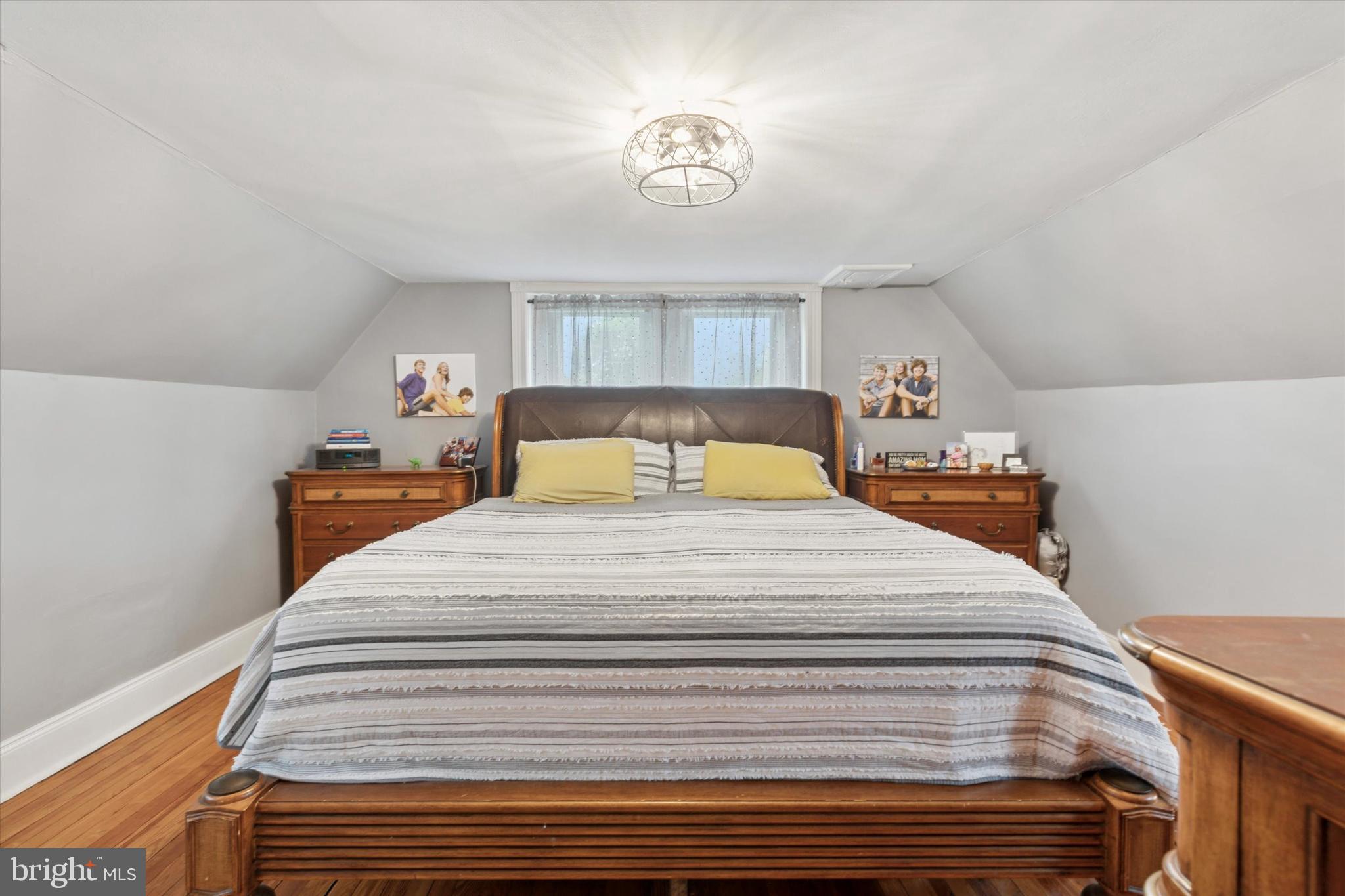 802 Upper Gulph Road Wayne, PA 19087 - Photo 30 of 45 a bedroom with a bed and a chandelier