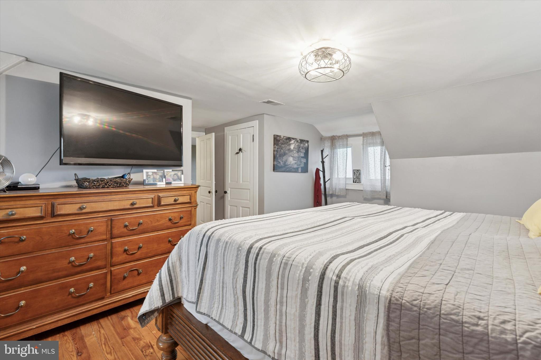 802 Upper Gulph Road Wayne, PA 19087 - Photo 31 of 45 a bedroom with a bed and a flat screen tv