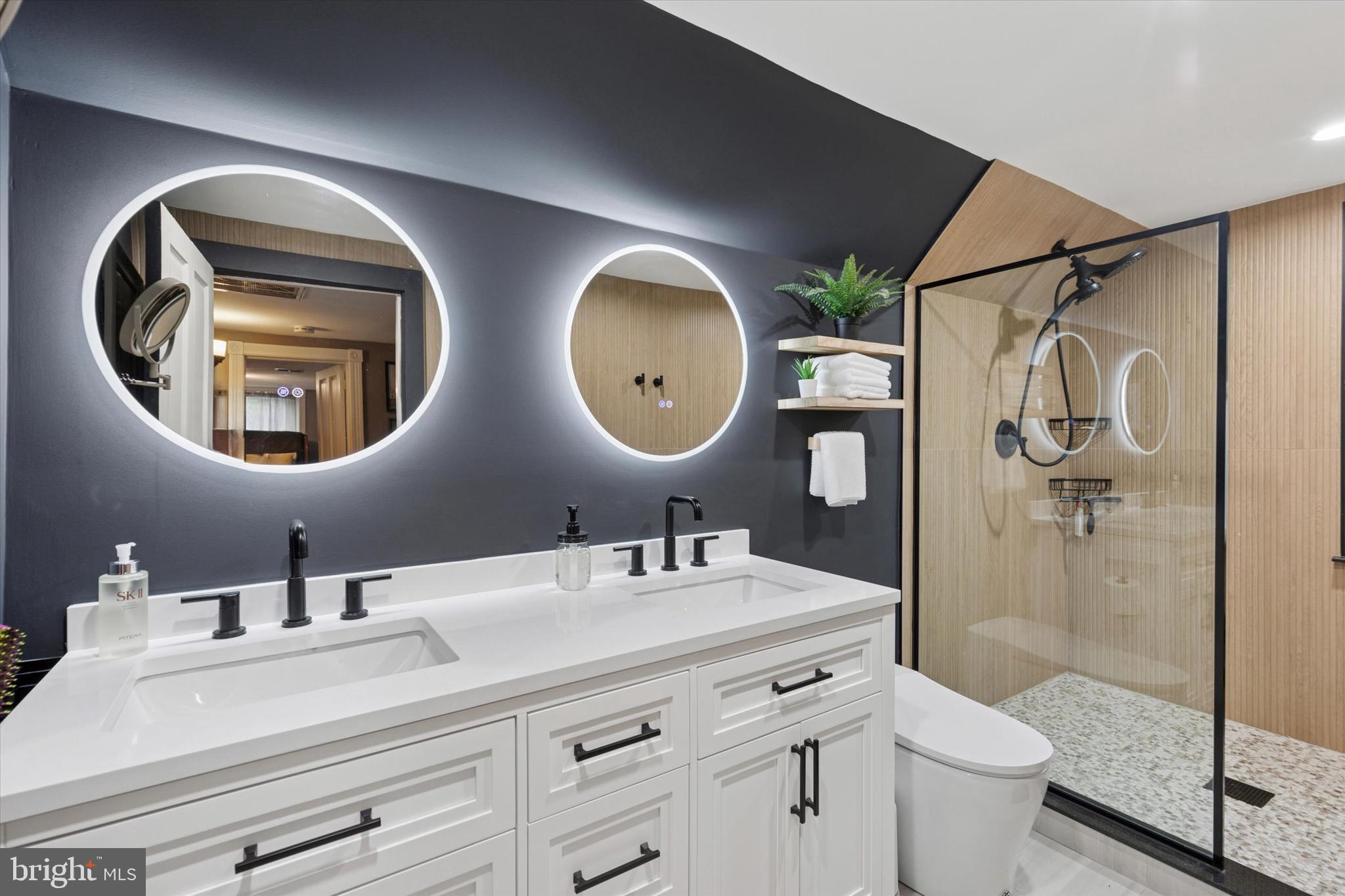 802 Upper Gulph Road Wayne, PA 19087 - Photo 32 of 45 a bathroom with a double vanity sink toilet and a mirror