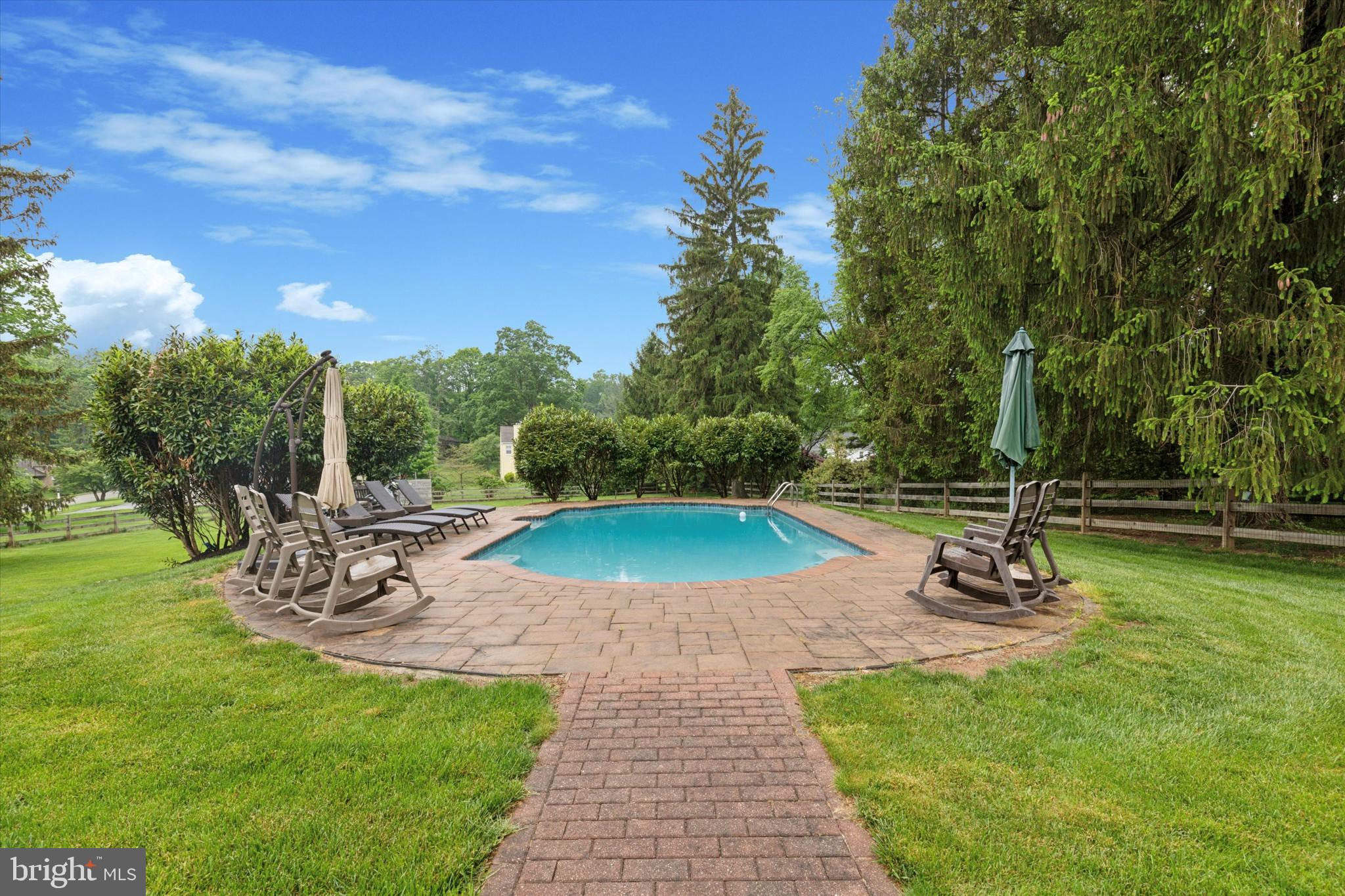 802 Upper Gulph Road Wayne, PA 19087 - Photo 5 of 45 a view of a swimming pool with sitting area