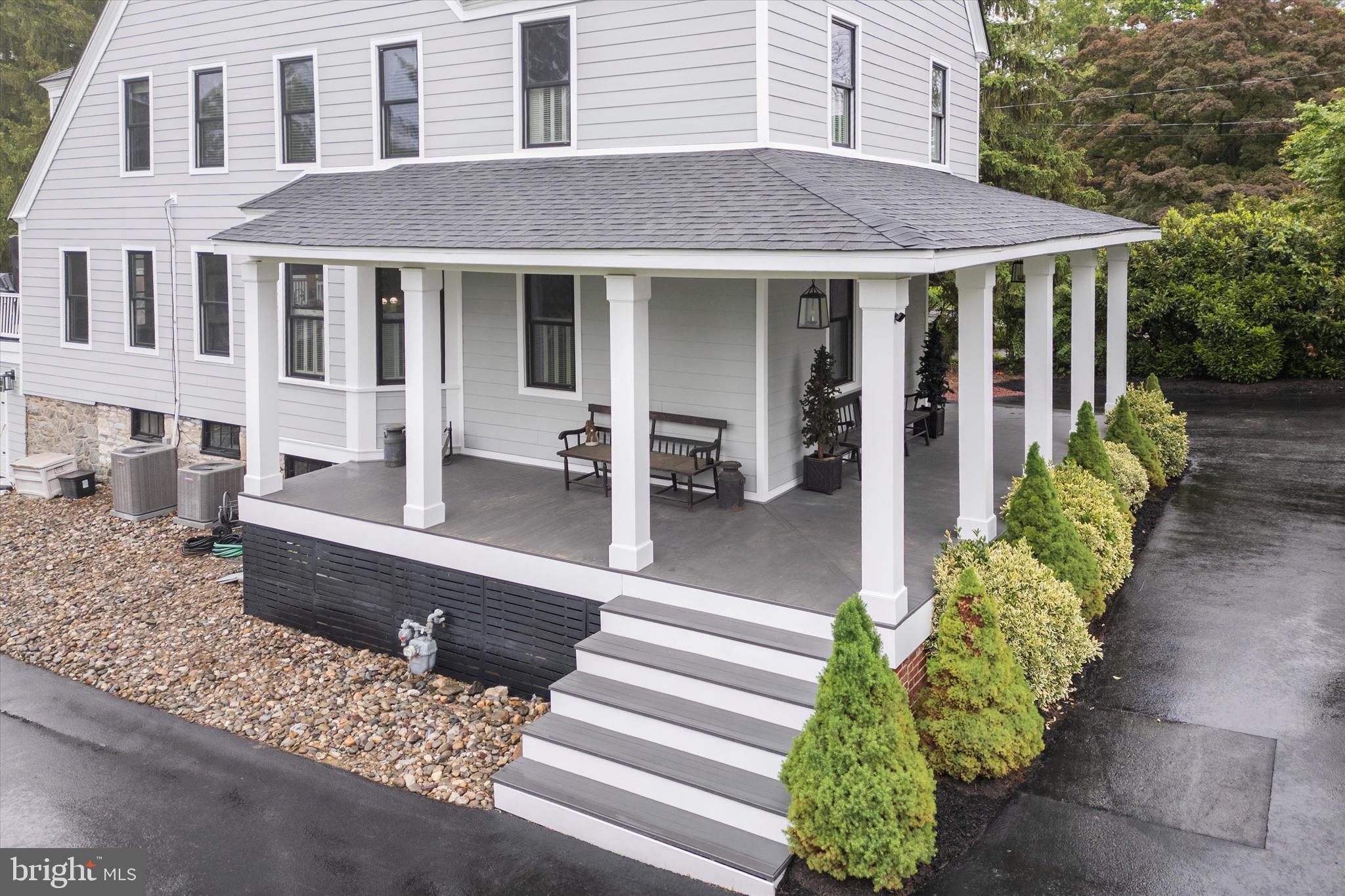 802 Upper Gulph Road Wayne, PA 19087 - Photo 7 of 45 a front view of a house with a garden and plants
