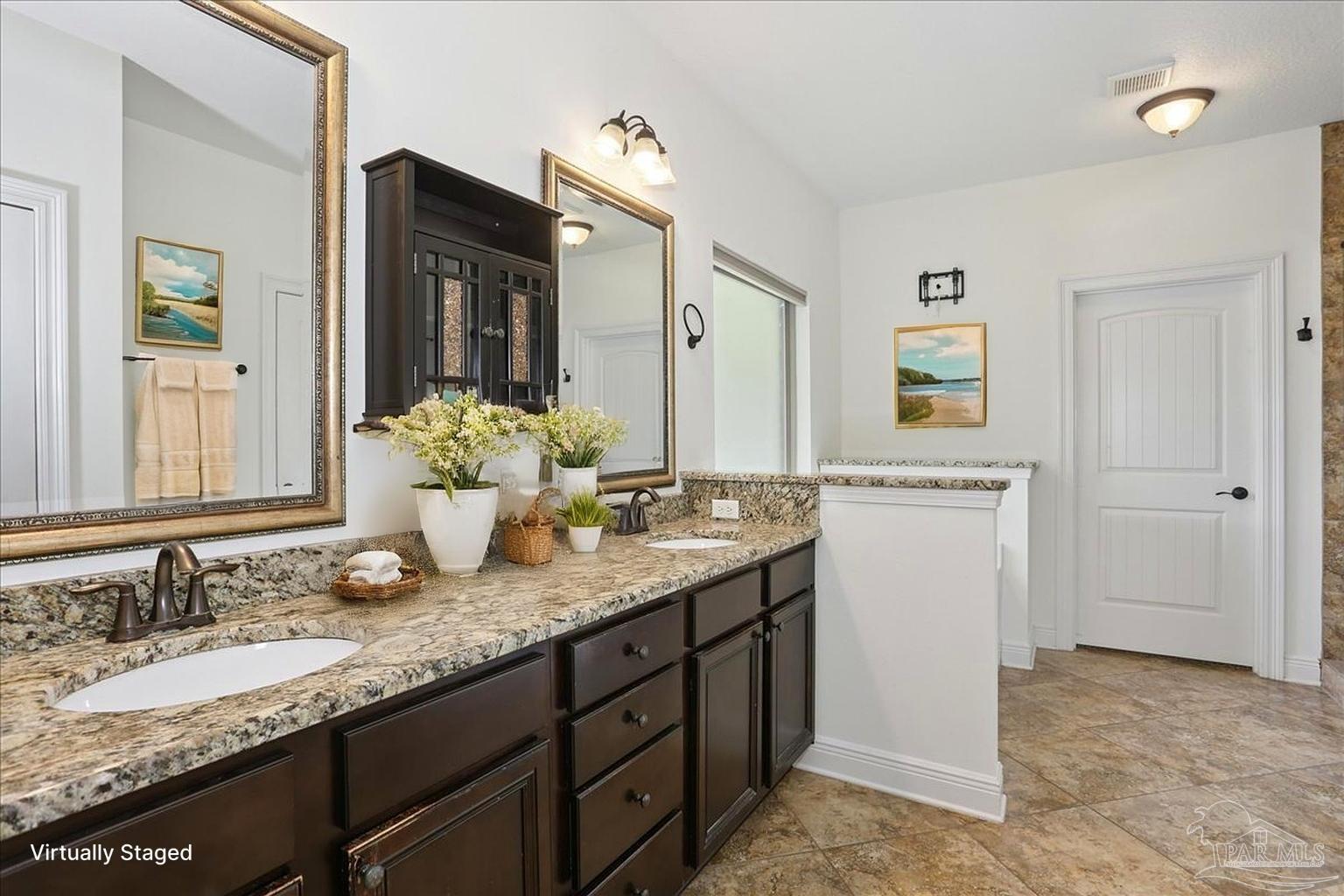 8414 Foxtail Loop Pensacola, FL 32526 - Photo 25 of 61 a bathroom with a granite countertop sink and a mirror