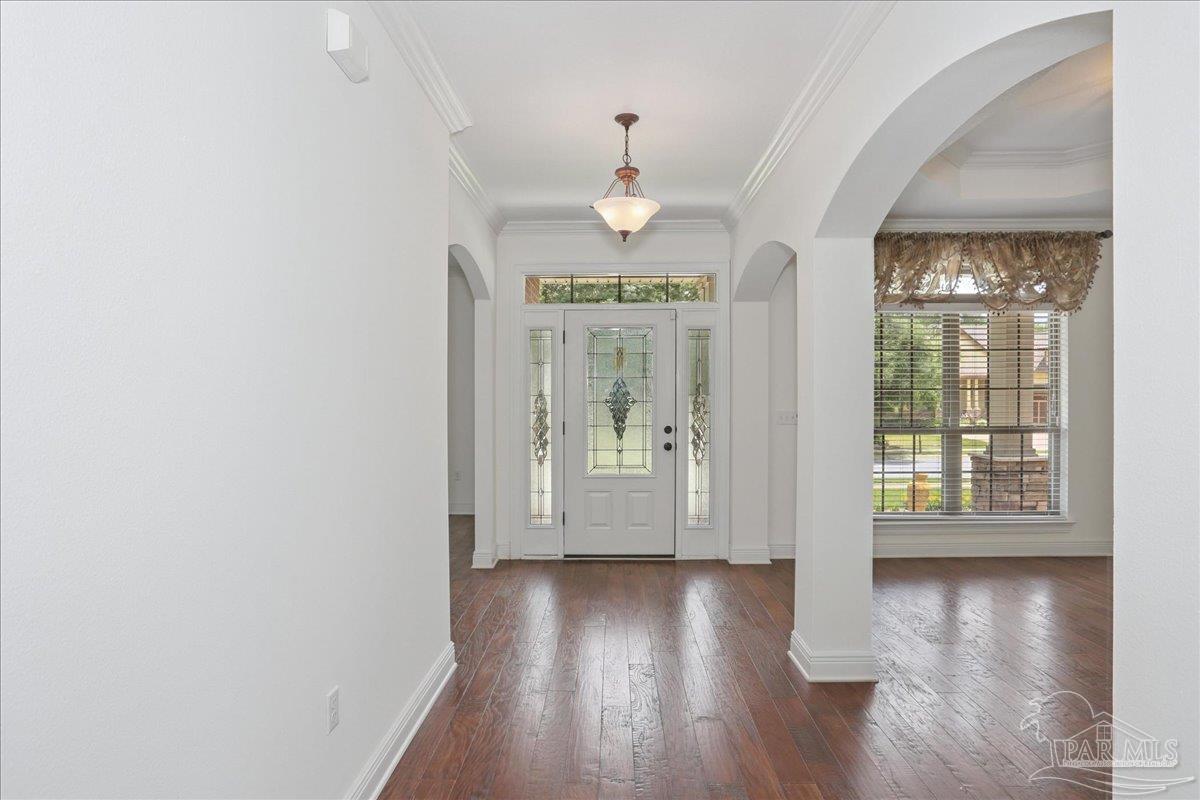 8414 Foxtail Loop Pensacola, FL 32526 - Photo 3 of 61 wooden floor in an empty room with a window