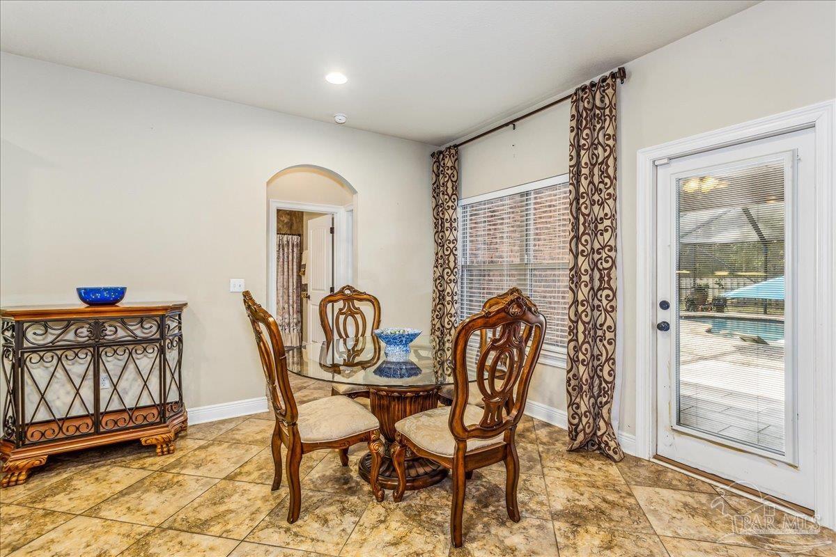 8414 Foxtail Loop Pensacola, FL 32526 - Photo 32 of 61 a dining room with furniture and window