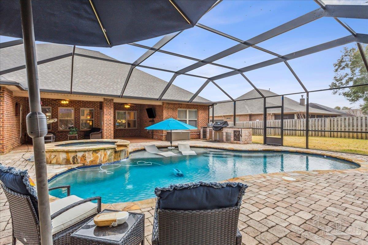 8414 Foxtail Loop Pensacola, FL 32526 - Photo 49 of 61 a view of a swimming pool with a patio