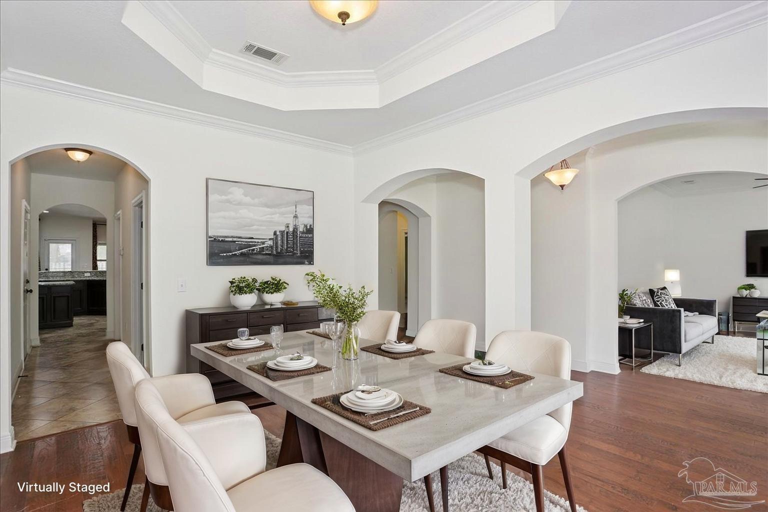 8414 Foxtail Loop Pensacola, FL 32526 - Photo 9 of 61 a view of a dining room with furniture and wooden floor