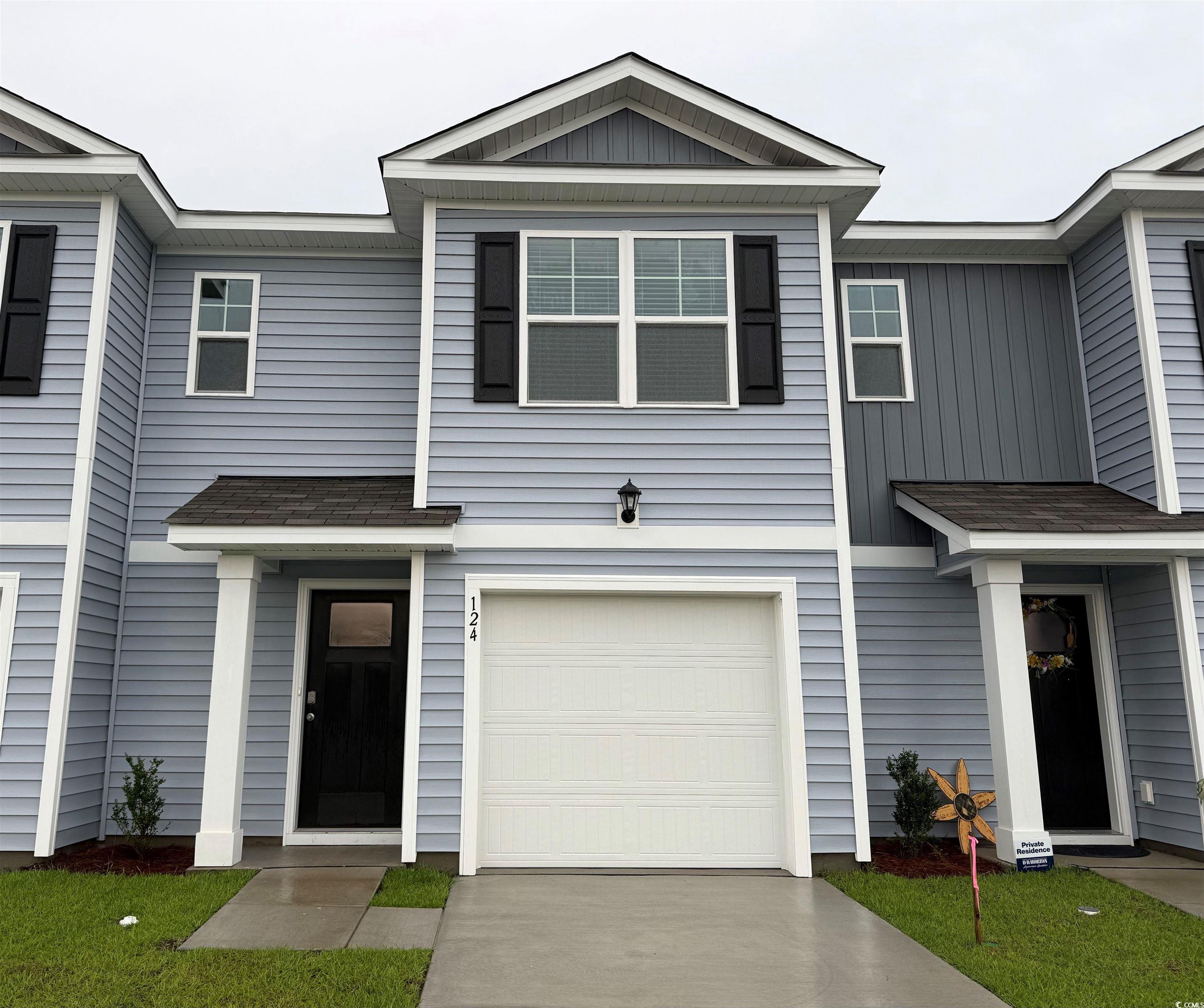 View of front of house with an attached garage, dr