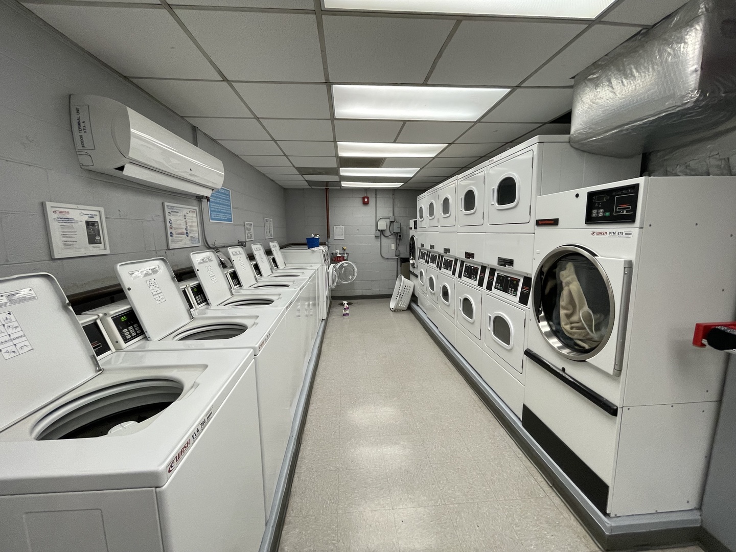 3900 North Lake Shore Drive, Unit 25C Chicago, IL 60613 - Photo 16 of 23 a utility room with dryer washer and a view of kitchen