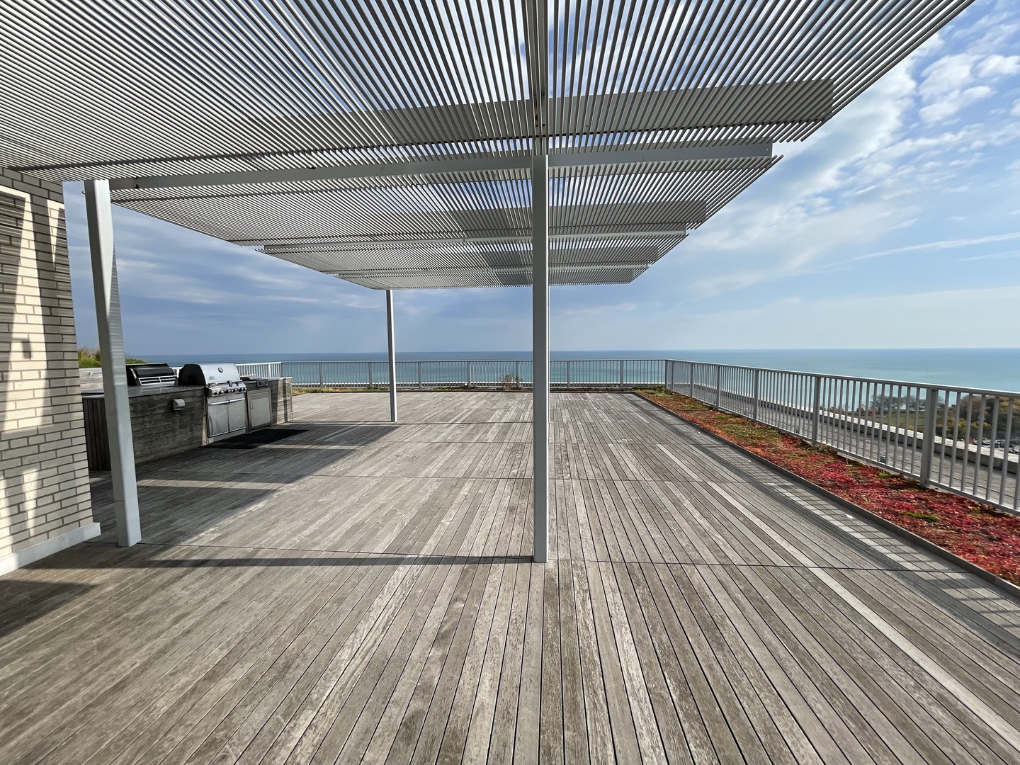 3900 North Lake Shore Drive, Unit 25C Chicago, IL 60613 - Photo 18 of 23 a view of a balcony with wooden floor