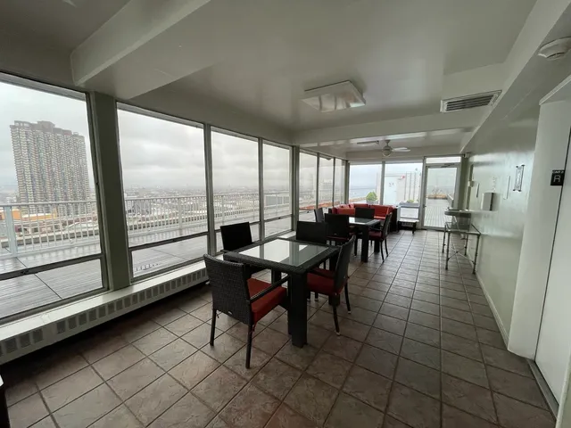 a view of a lobby with furniture and potted plants