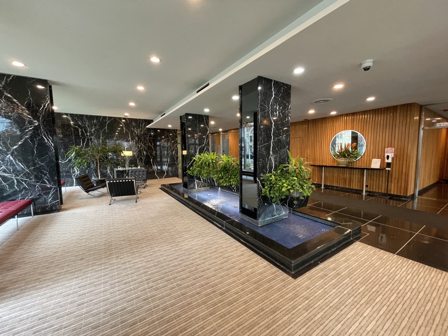 3900 North Lake Shore Drive, Unit 25C Chicago, IL 60613 - Photo 23 of 23 a view of a lobby with furniture and potted plants