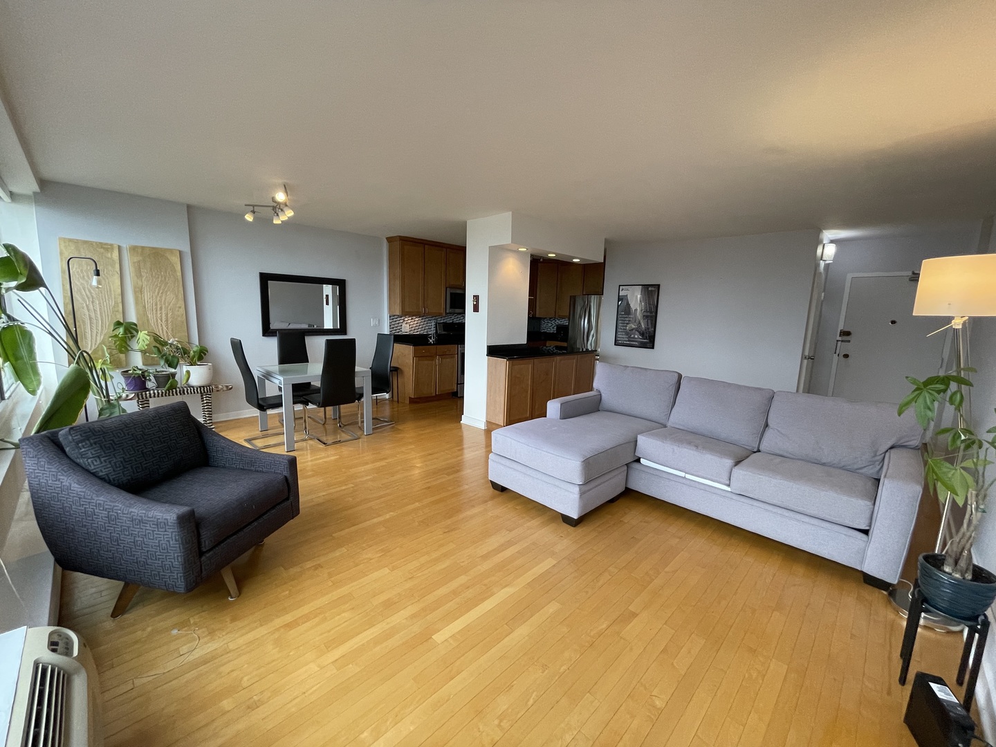 3900 North Lake Shore Drive, Unit 25C Chicago, IL 60613 - Photo 7 of 23 a living room with furniture and a couch