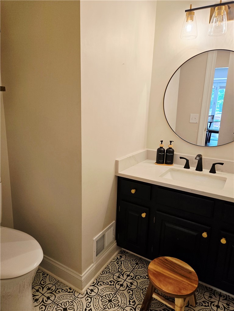 1081 Bright Stream Way Webster, NY 14580 - Photo 25 of 50 There is a powder room down the hall between the first floor laundry and the garage.