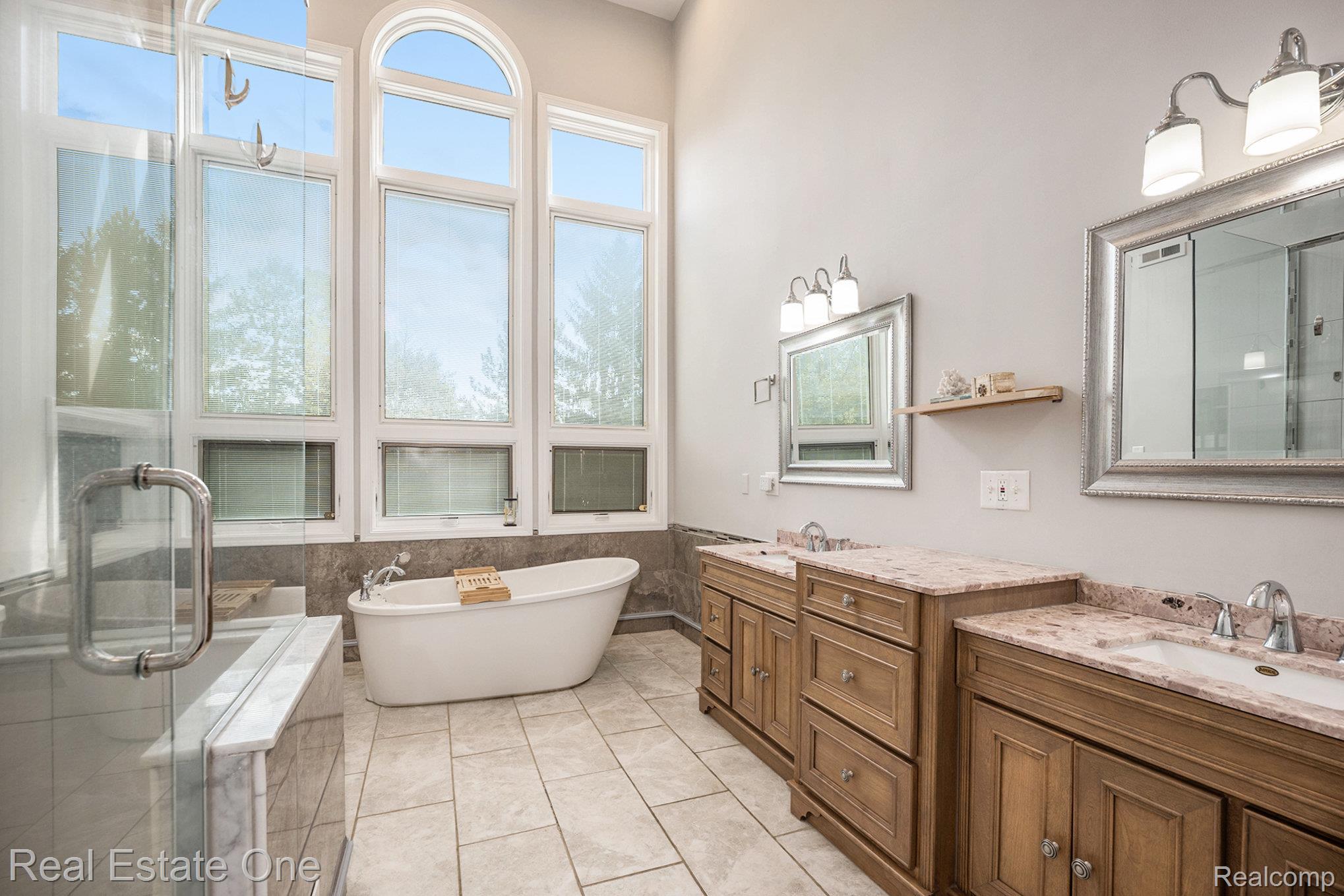 5772 North Rochester Road Rochester, MI 48306 - Photo 32 of 50 Bathroom featuring a freestanding bath, a shower stall, tile walls, vanity, and light tile patterned flooring