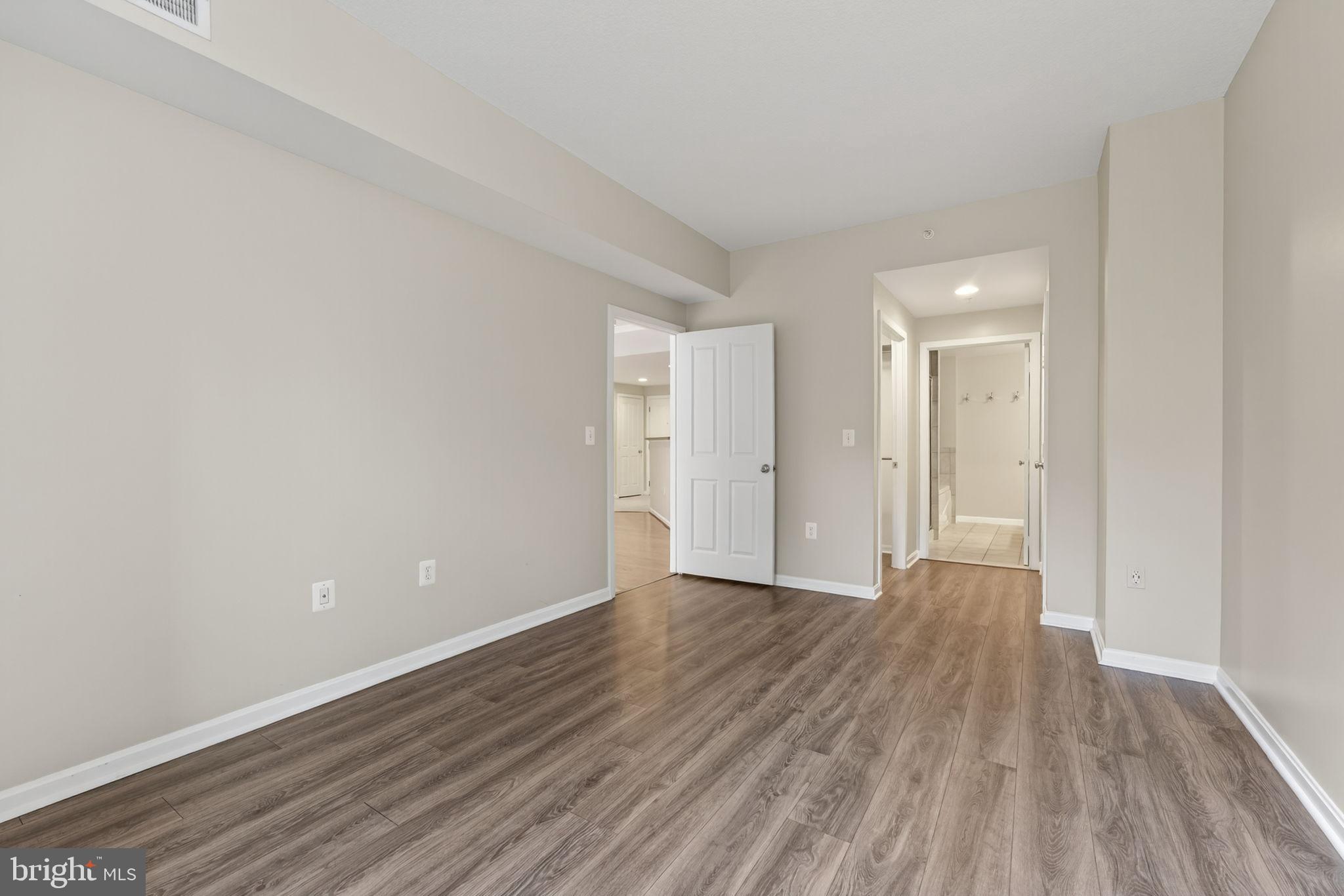 2220 Fairfax Drive, Unit 206 Arlington, VA 22201 - Photo 17 of 25 a view of an empty room and wooden floor
