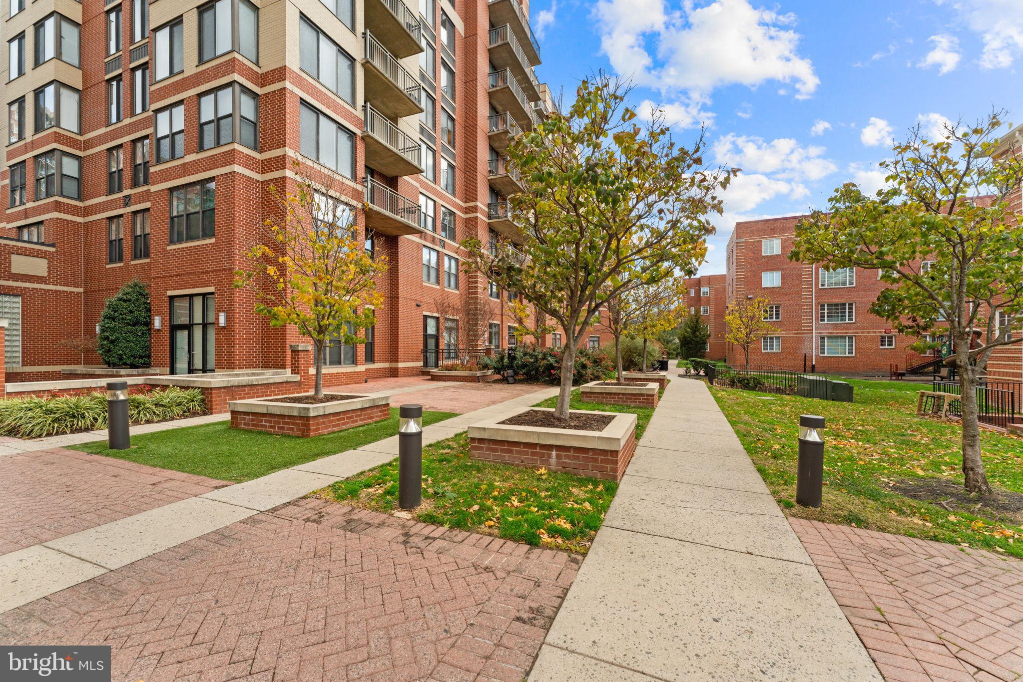 2220 Fairfax Drive, Unit 206 Arlington, VA 22201 - Photo 24 of 25 a front view of a building with large trees