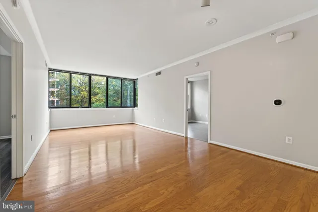 a view of an empty room with a window