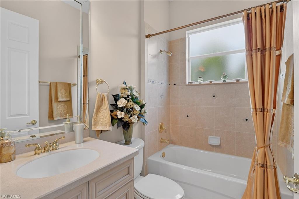 1964 Rialto Way Alva, FL 33920 - Photo 27 of 50 a bathroom with a sink toilet and shower