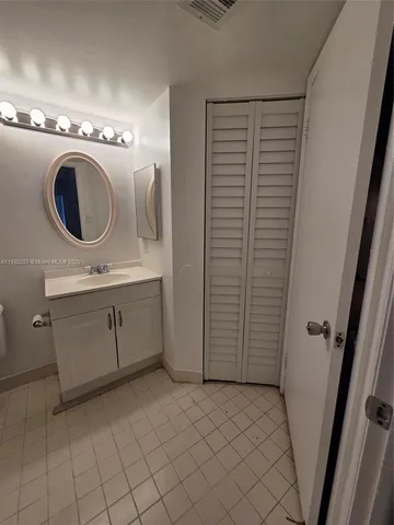 a view of a storage & utility room with a sink
