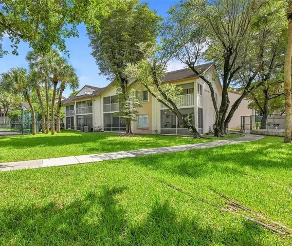 a view of a park with large trees