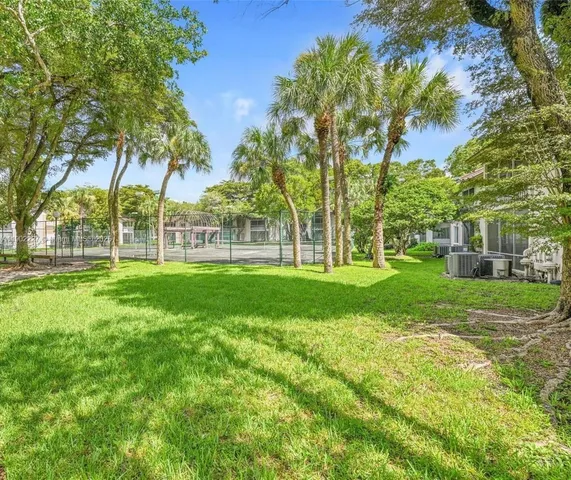 a view of street with parked cars
