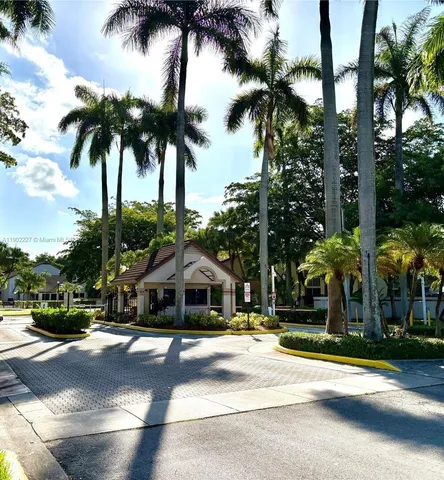 a view of a backyard with swimming pool