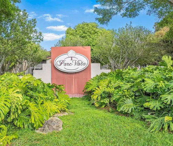 a view of a swimming pool with a garden