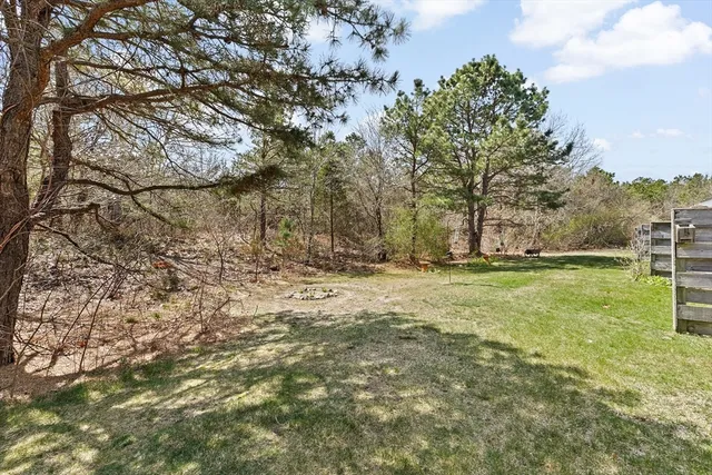 a front view of a building with a garden