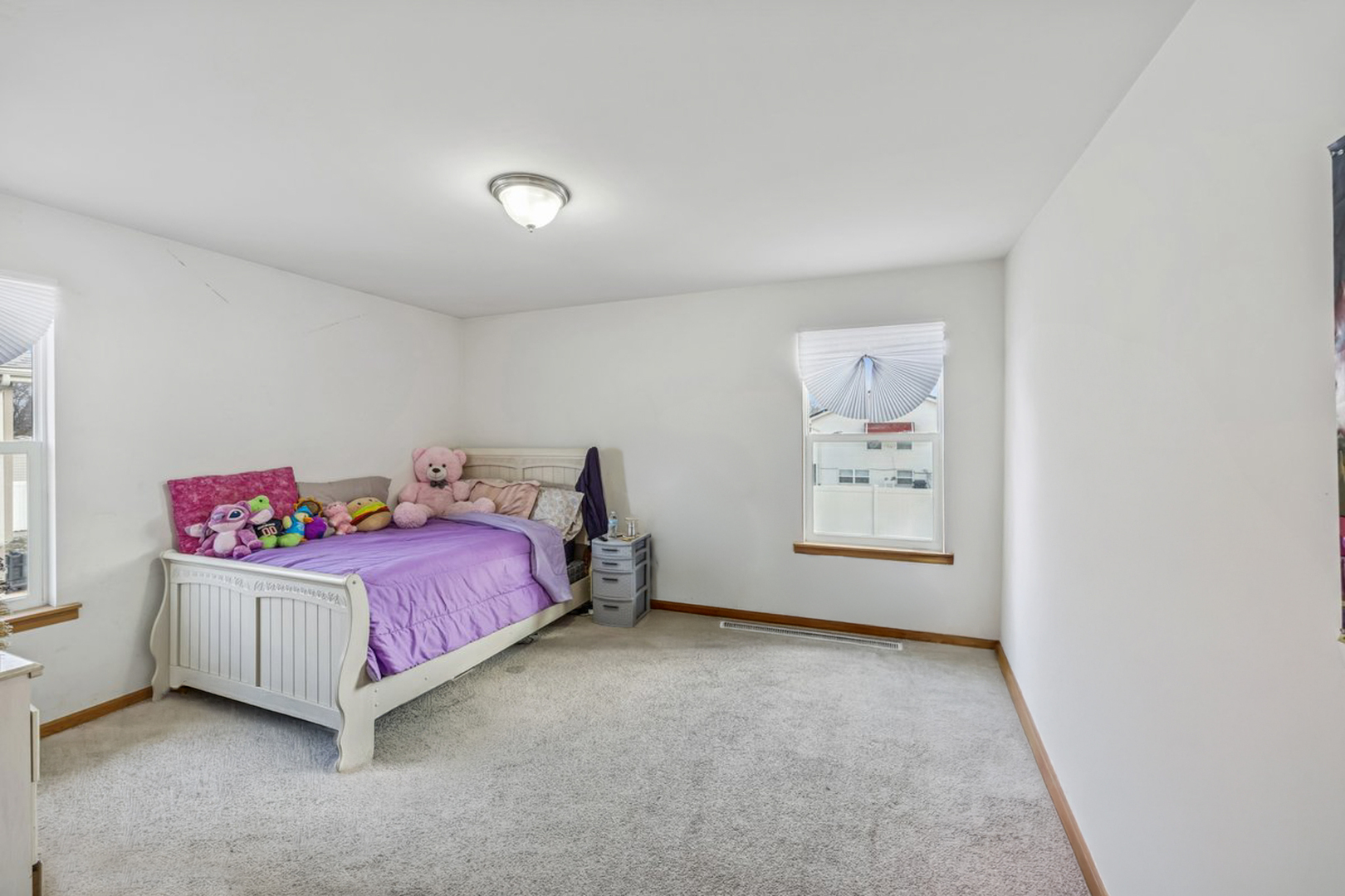 14925 Whipple Street Markham, IL 60428 - Photo 12 of 16 a bedroom with a bed and a window