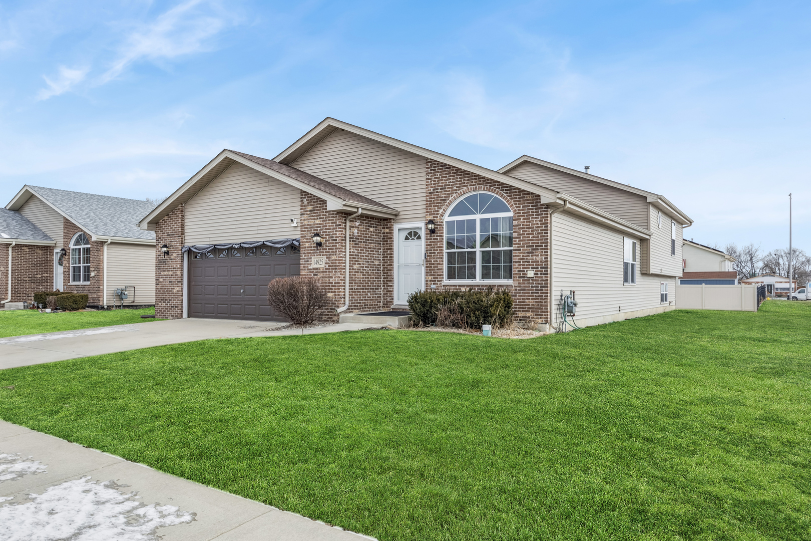 14925 Whipple Street Markham, IL 60428 - Photo 2 of 16 a front view of house with yard and green space