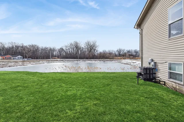a view of outdoor space with deck and yard