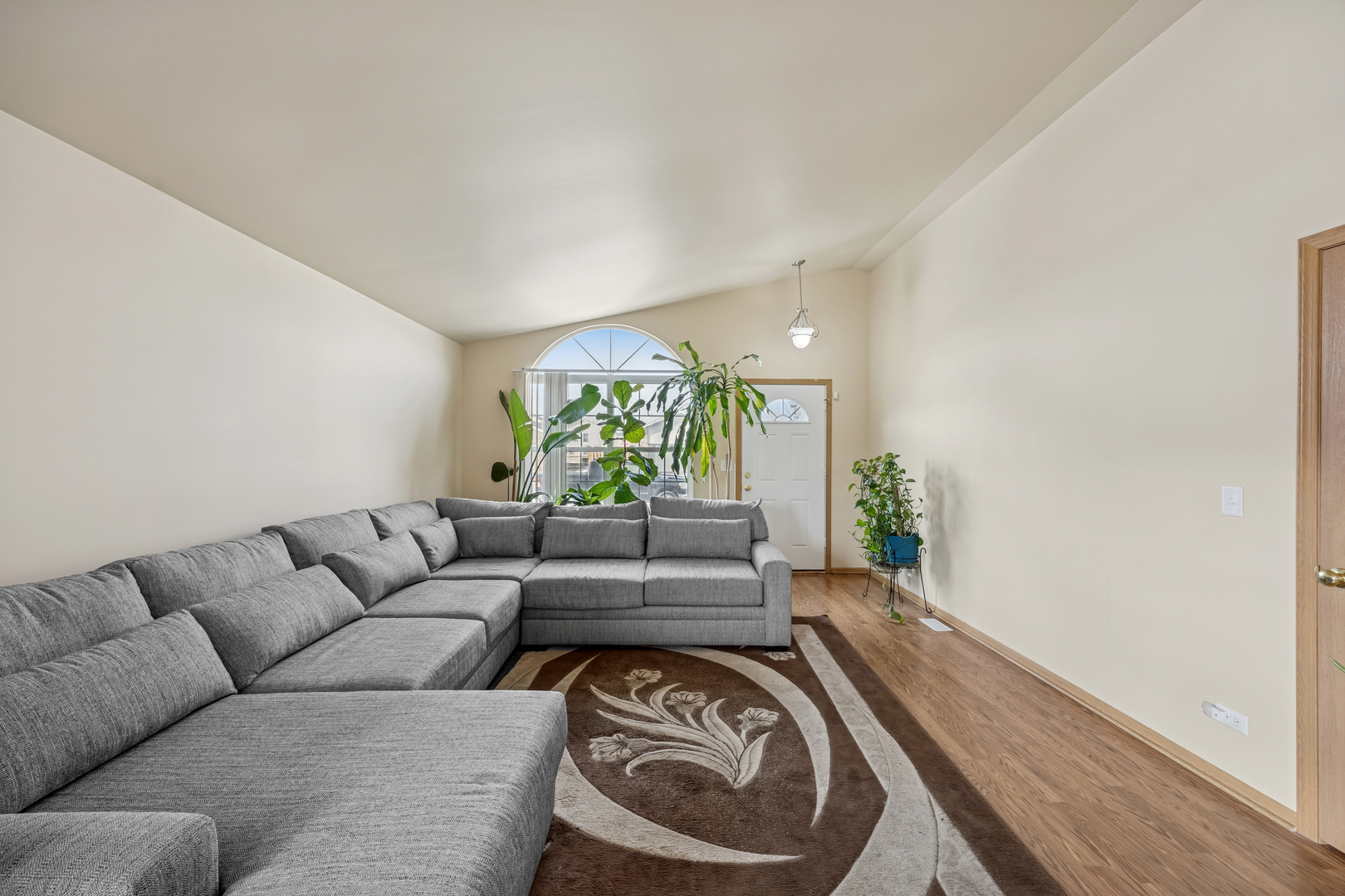 14925 Whipple Street Markham, IL 60428 - Photo 5 of 16 a living room with furniture and a large window