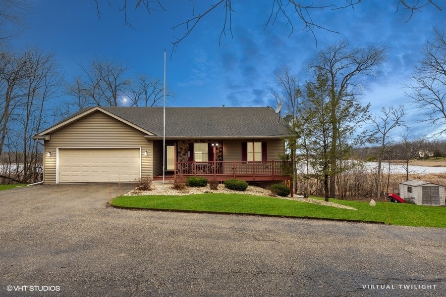 W6530 Barkers Road Elkhorn, WI 53121 - Photo 1 of 19 a front view of house with yard and green space