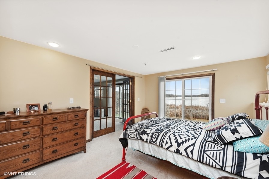 W6530 Barkers Road Elkhorn, WI 53121 - Photo 14 of 19 a bedroom with a bed and a dresser
