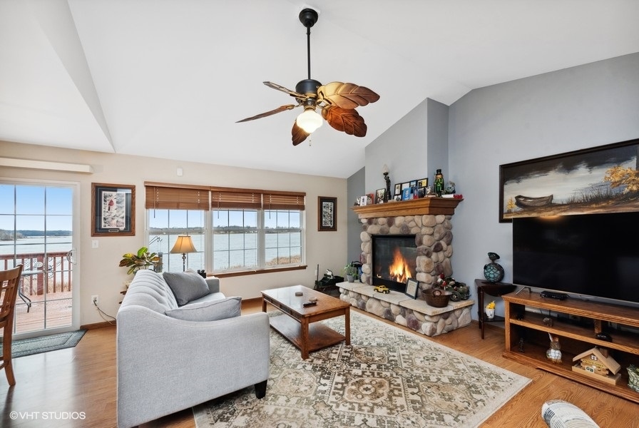 W6530 Barkers Road Elkhorn, WI 53121 - Photo 5 of 19 a living room with furniture a rug and a fireplace
