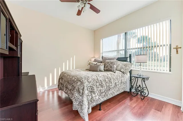 a bed room with a bed and a chair