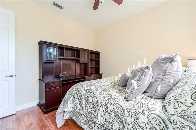 a bedroom with a bed and dresser