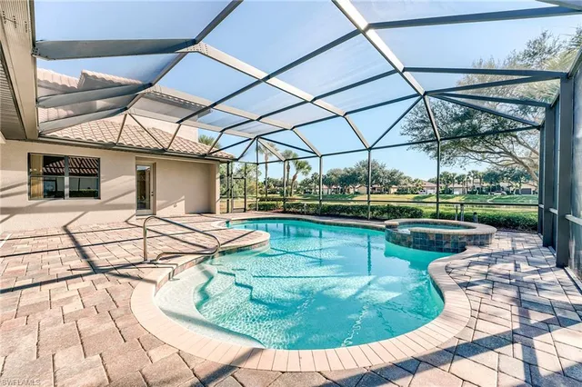a view of a swimming pool with a patio