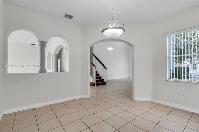 a kitchen with stainless steel appliances granite countertop wooden cabinets and sink