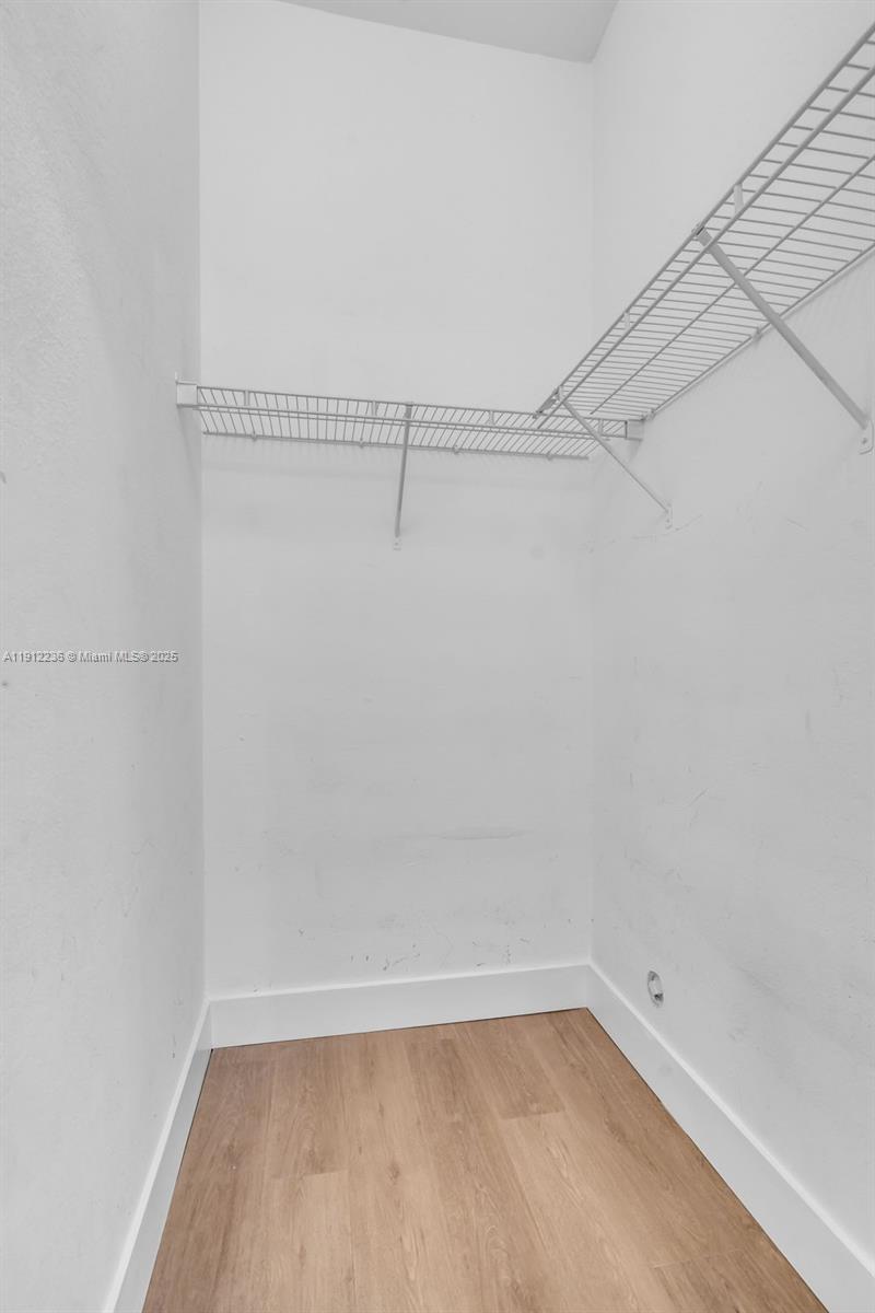 8920 Northwest 180th Terrace Hialeah, FL 33018 - Photo 18 of 44 a view of a room with racks on the wall