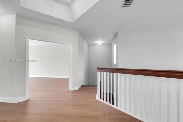 a view of a livingroom with wooden floor