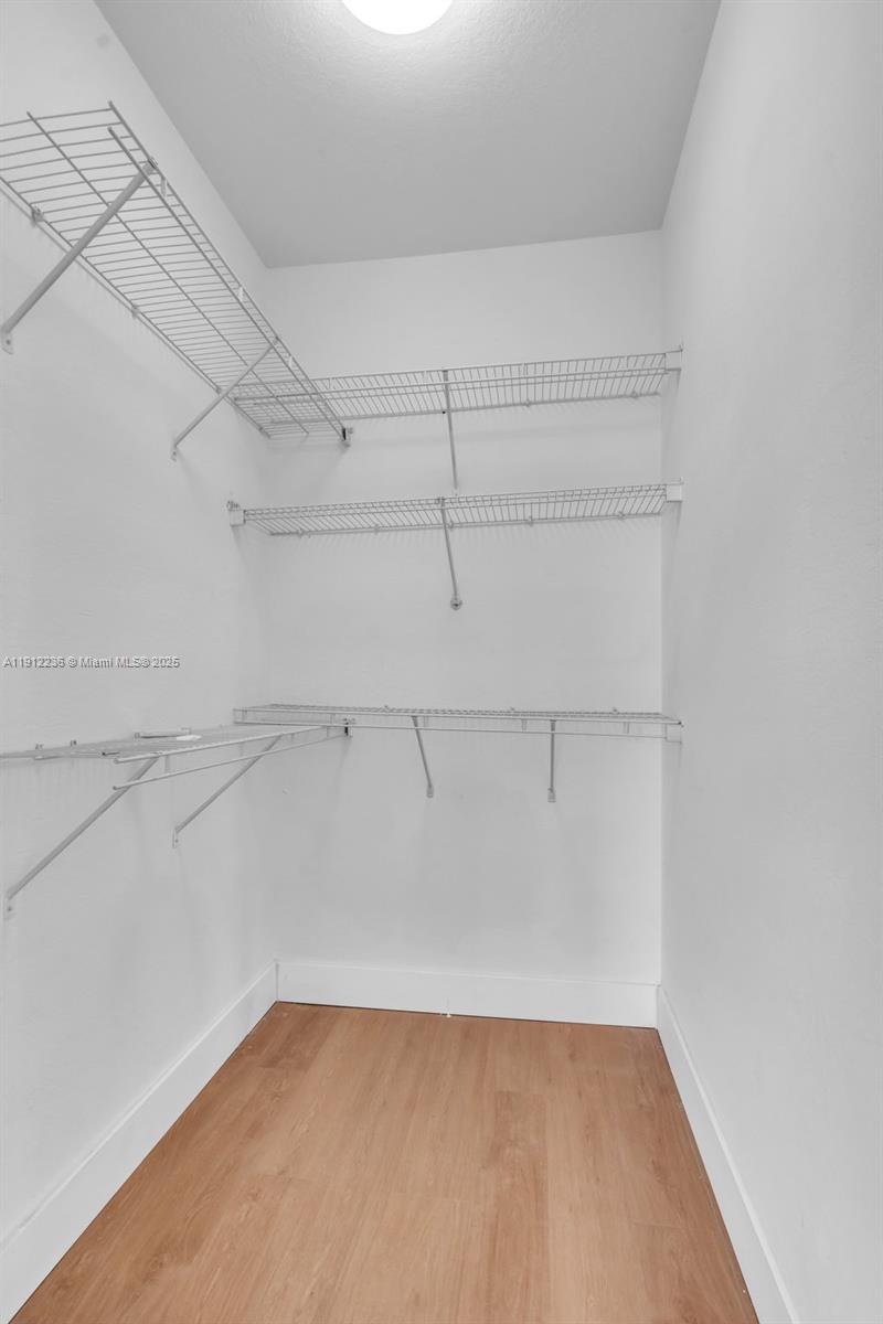 8920 Northwest 180th Terrace Hialeah, FL 33018 - Photo 28 of 44 a view of a room with racks on the wall
