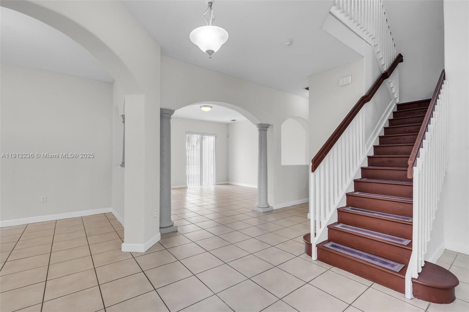 8920 Northwest 180th Terrace Hialeah, FL 33018 - Photo 3 of 44 a view of entryway and hall with a window