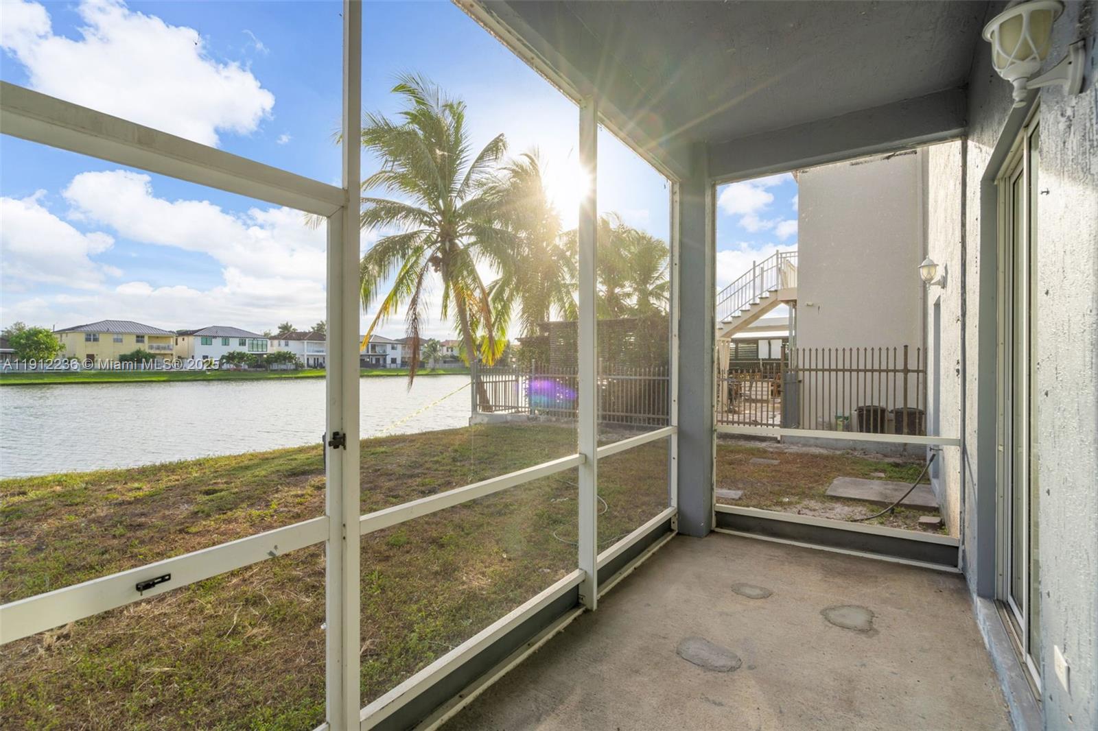 8920 Northwest 180th Terrace Hialeah, FL 33018 - Photo 35 of 44 a room with water view and large windows